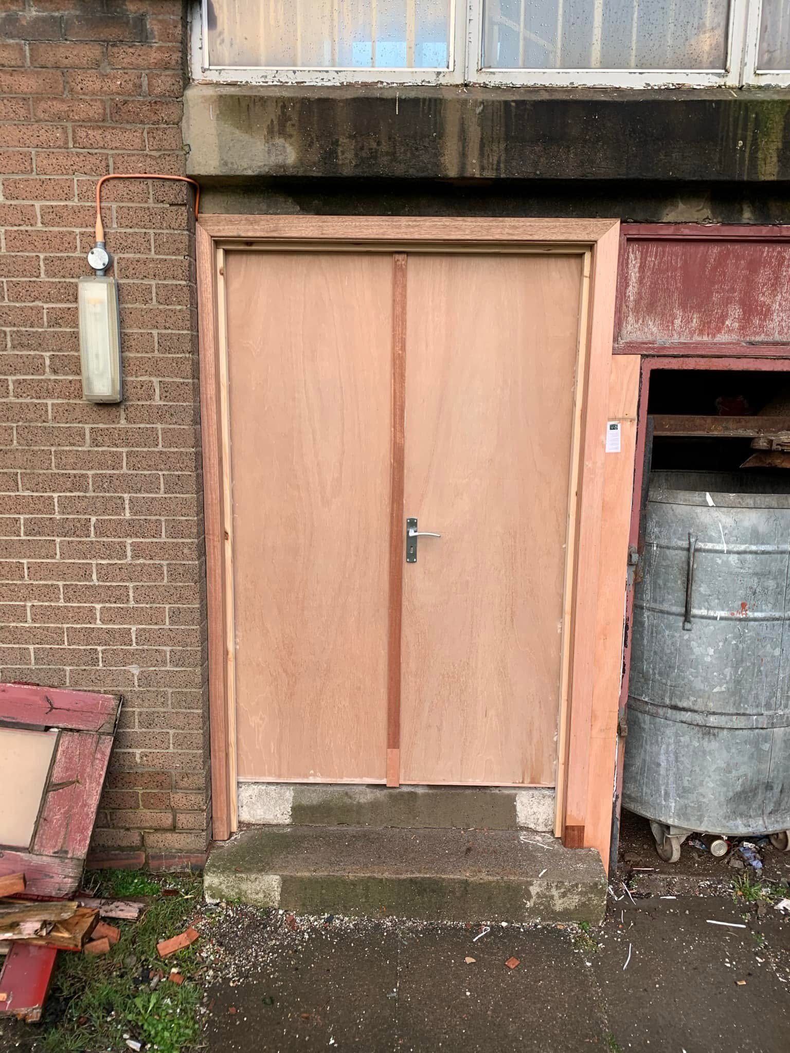 After — new double doors and frame, ready for the painter