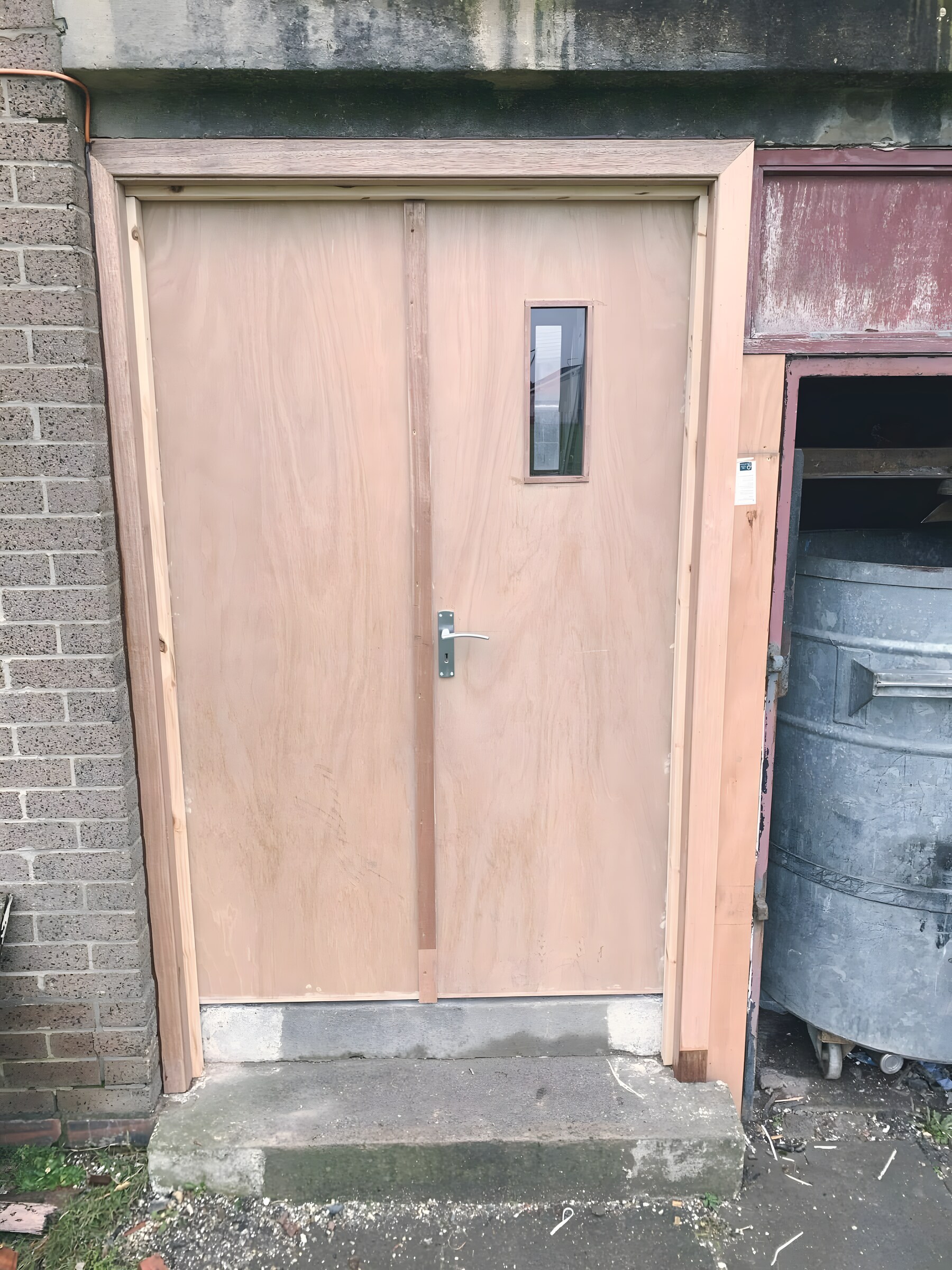 New close entrance doors, fitted and ready for the painter