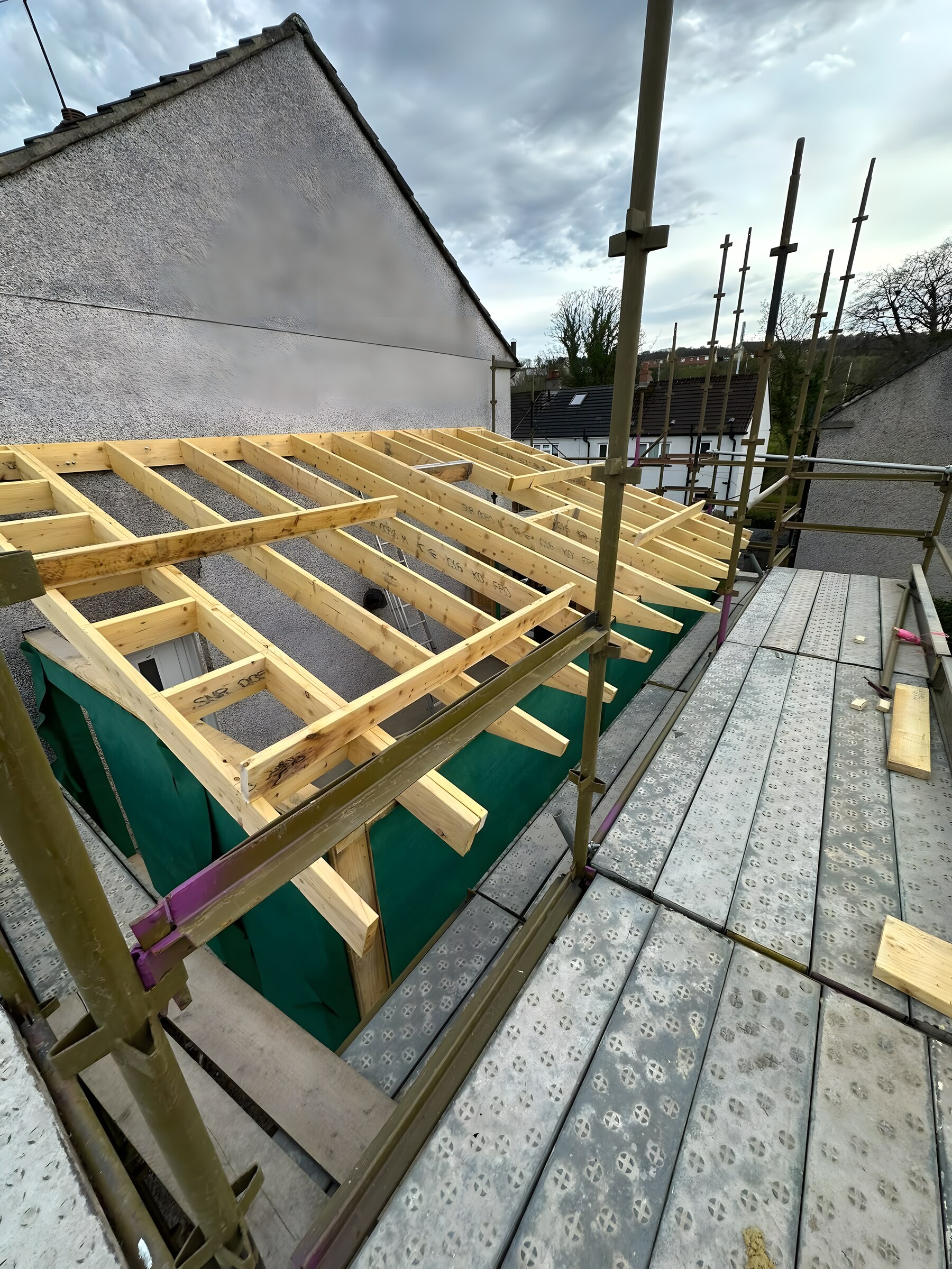 Roof joists going on — the timber frame of a rear extension