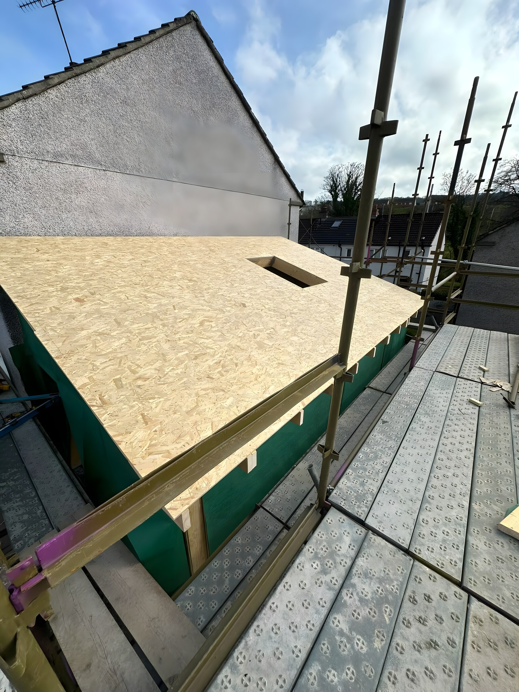 Roof deck boarded, the roof-light opening cut