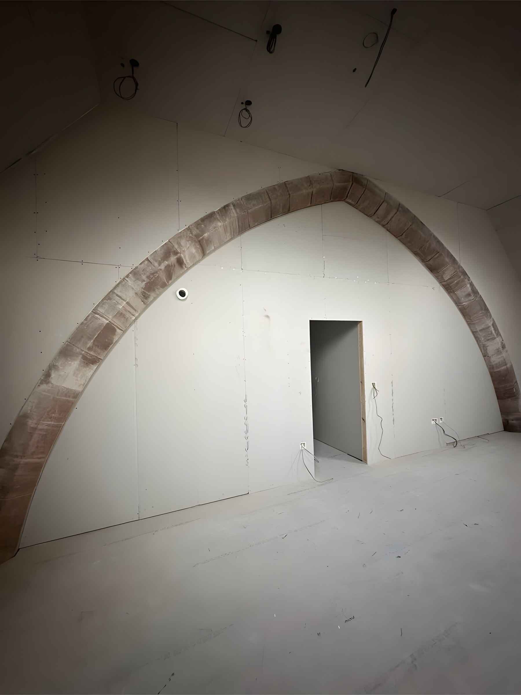 After — boarded out, the doorway formed and the arch left on show