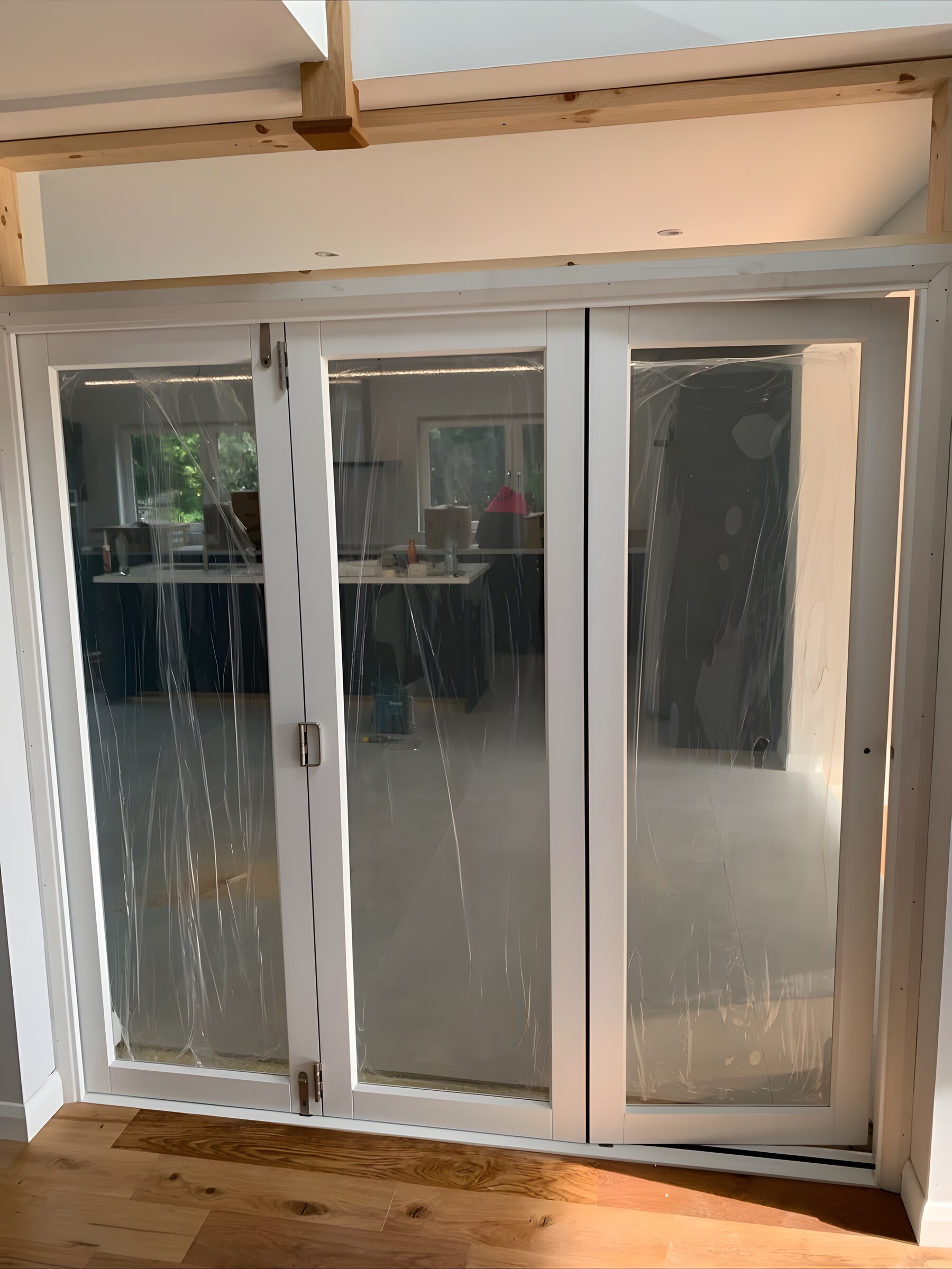 Glazed folding doors, the protective film still on