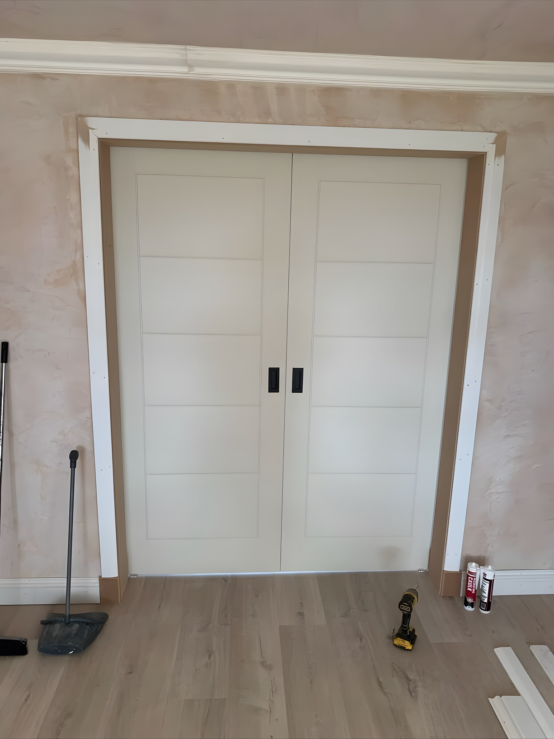 White double doors in a new lining, with the architrave on